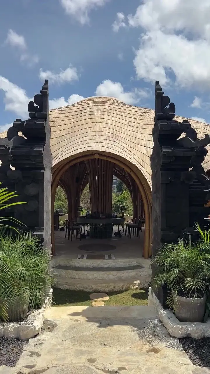 Walking through the carved candi gate into the bamboo main house of Bali Jewelry House