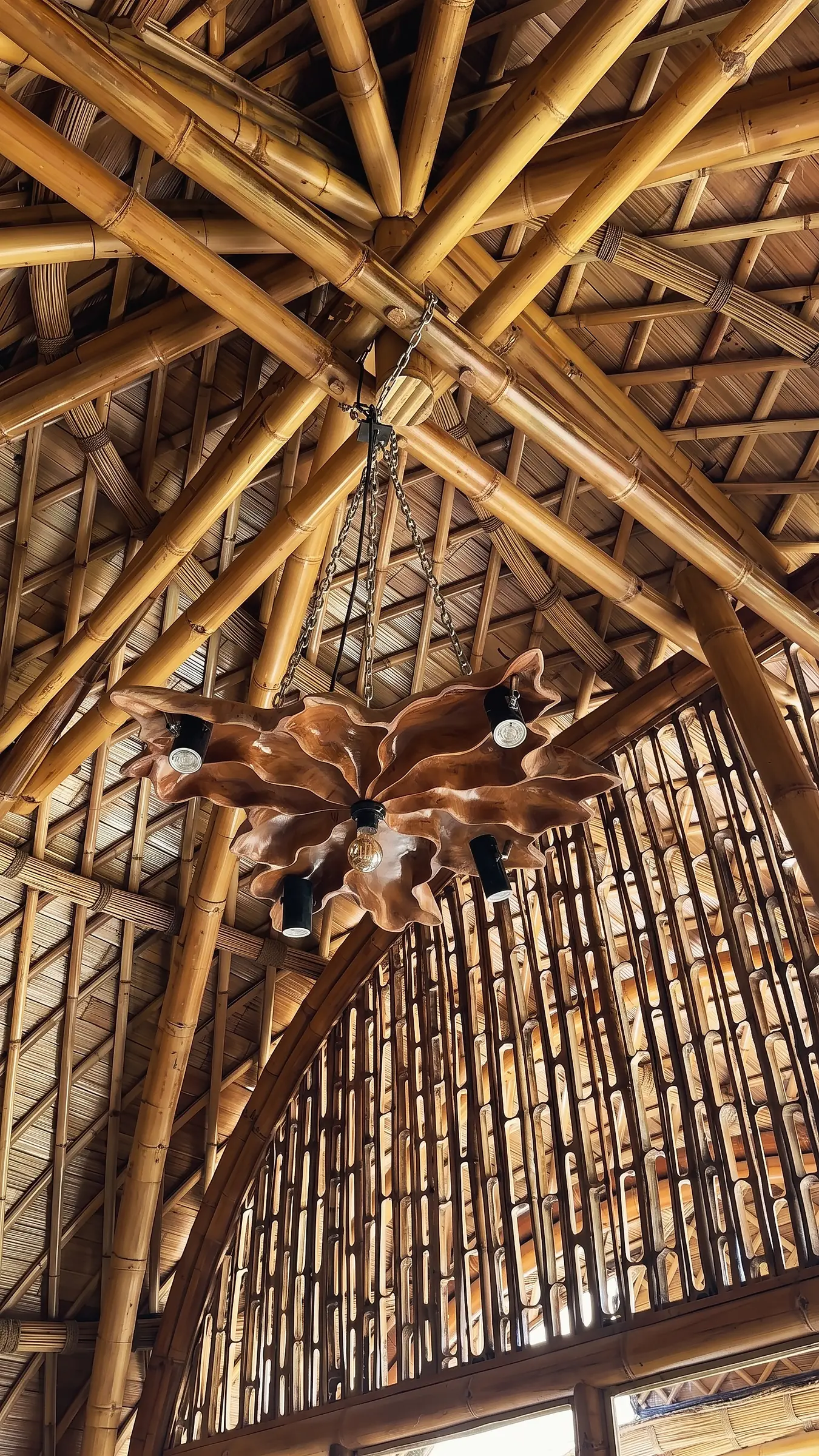 Looking up into the woven bamboo roof of the main hall
