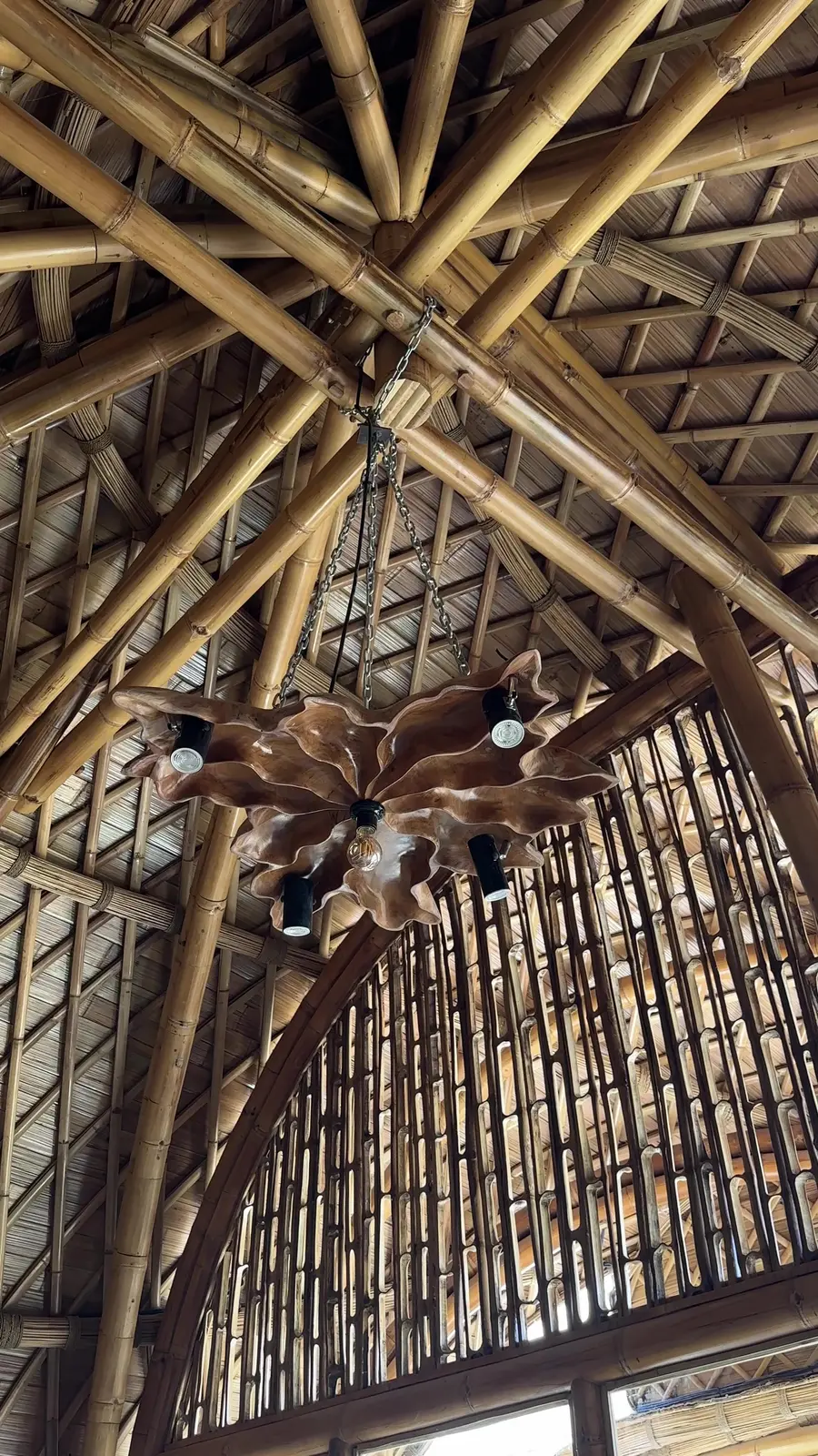 Looking up into the woven bamboo roof of the main hall